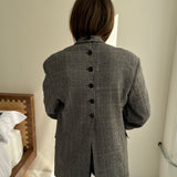 Double breasted black and white houndstooth button back blazer